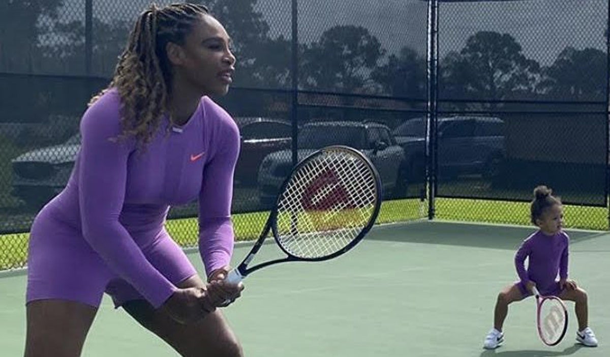 serena williams and daughter playing tennis in purple 